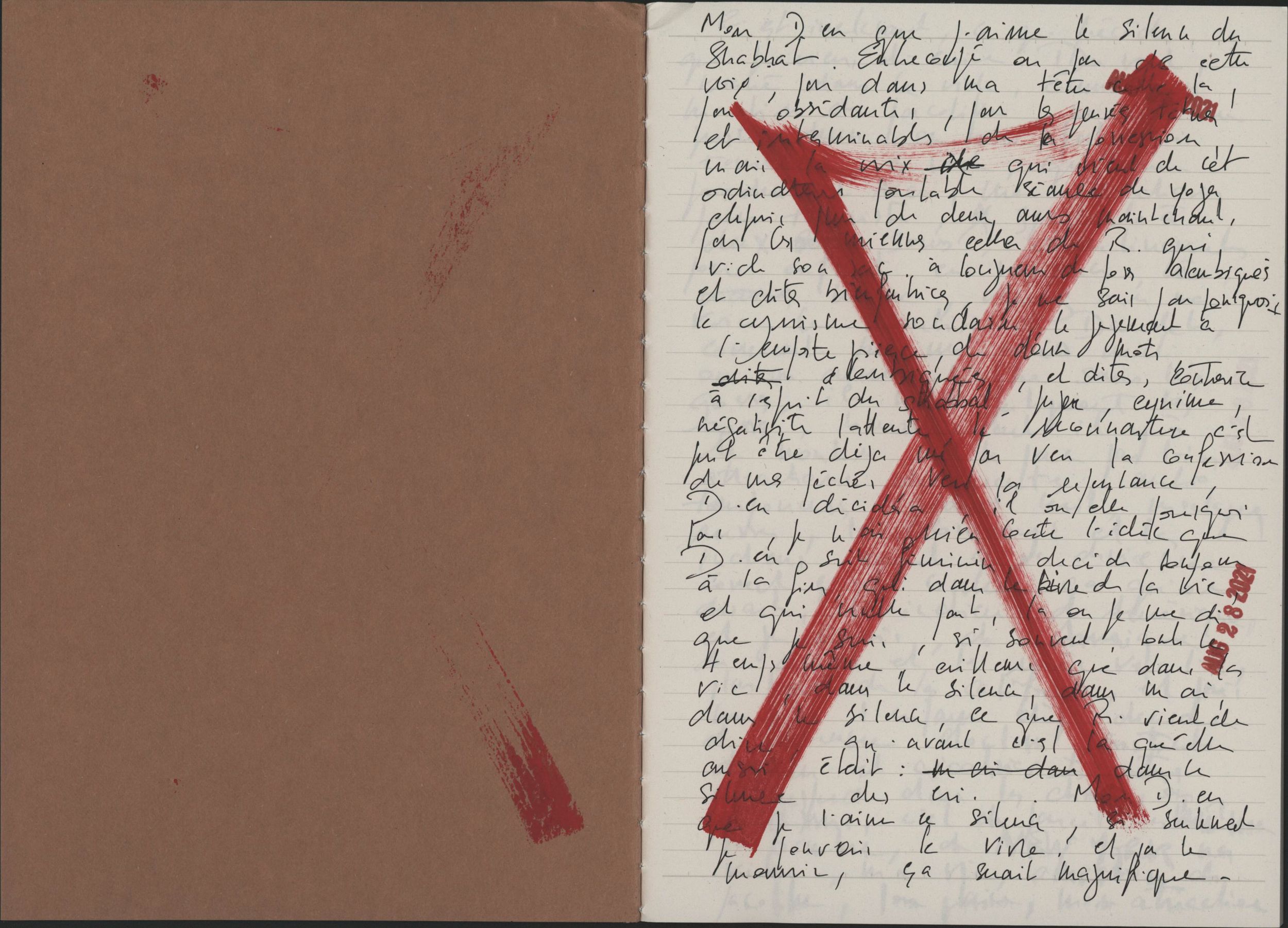 Handwritten letter with bold red X mark overlaid on cursive text, beside a brown cardboard cover.