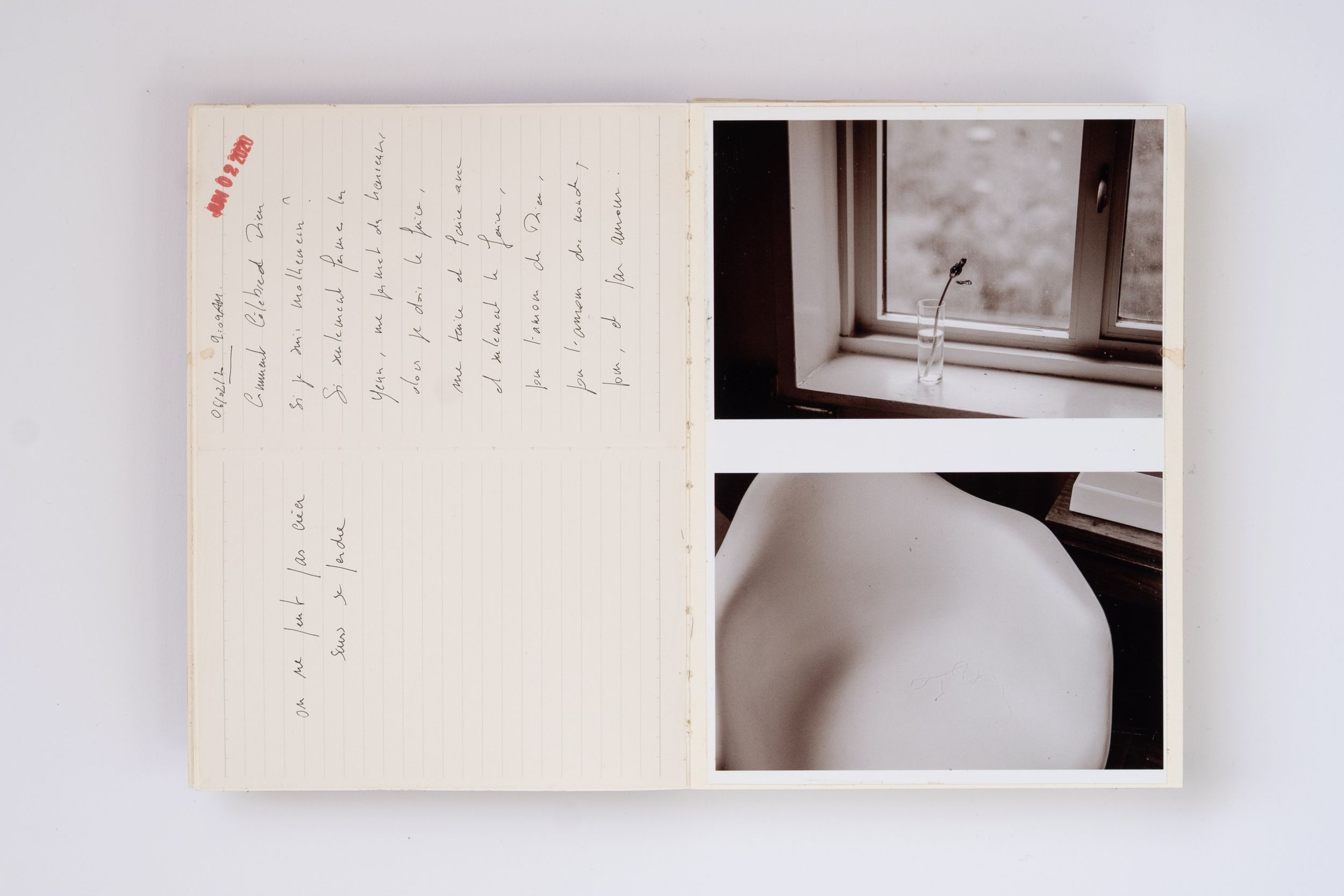 Open journal with handwritten notes beside two photos of a window and a white ceramic object.