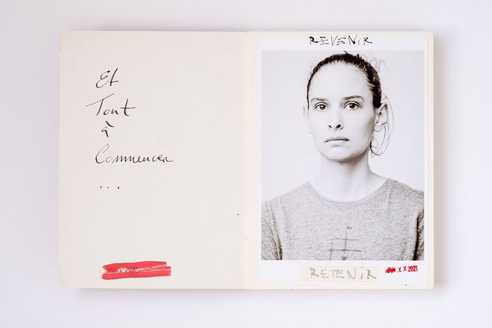 Open book with handwritten French text and a black-and-white portrait photo of a woman in a gray shirt.