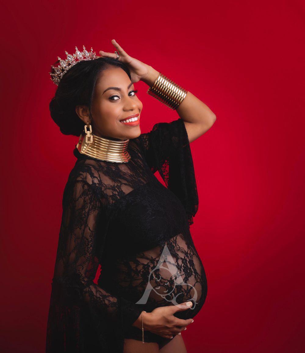 Studio Maternity Session black outfit on red background at The Affinity Studio in Coral Springs Florida