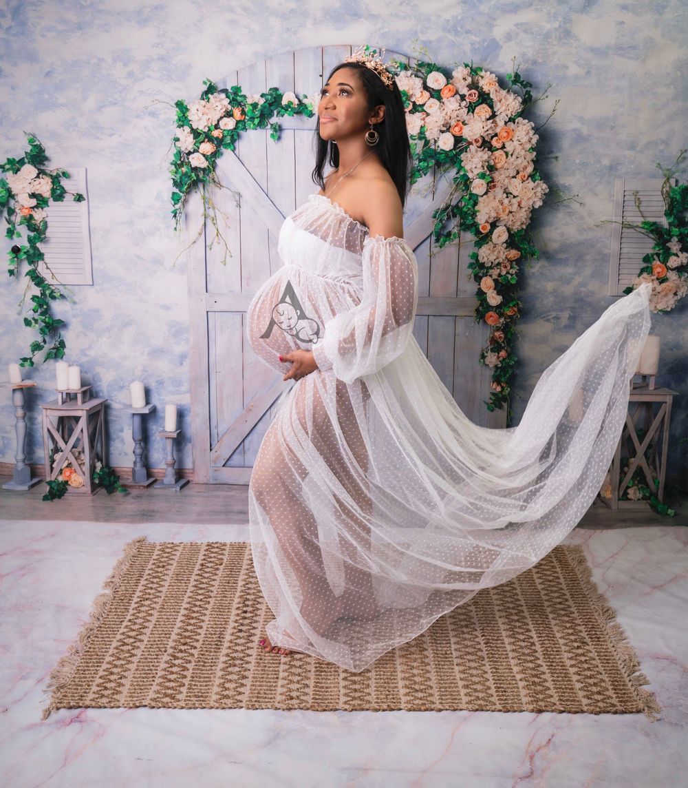 Studio Maternity Session white outfit on floral rustic background at The Affinity Studio in Coral Springs Florida