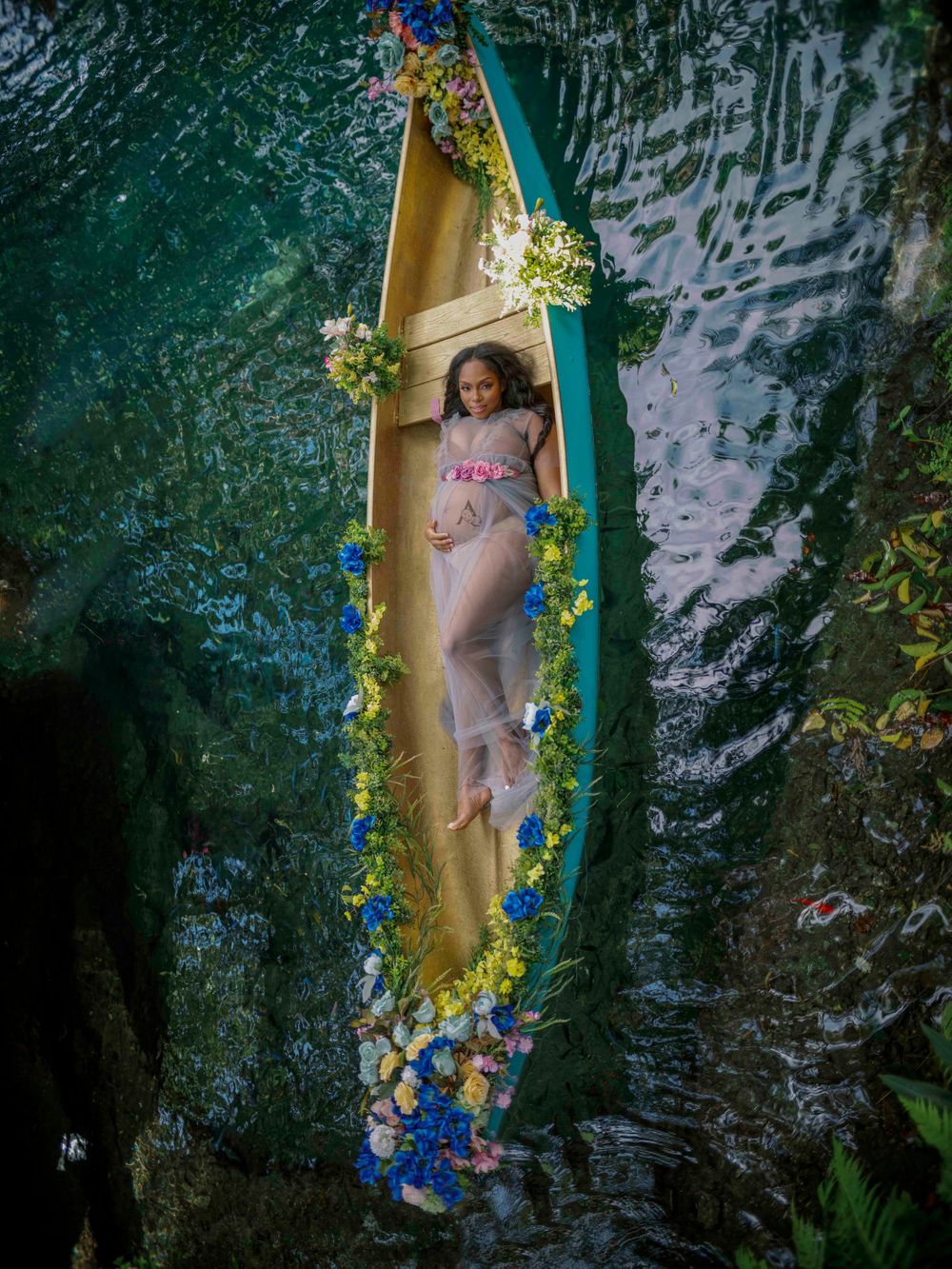 Maternity session in floral boat at The Secret Gardens Miami
