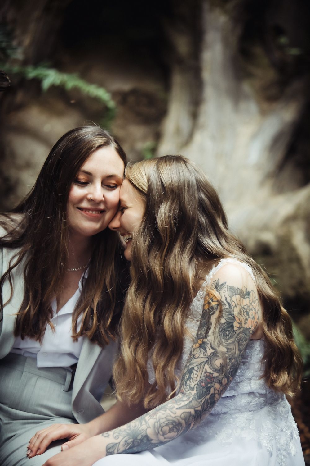 Two brides laughing on their elopement day