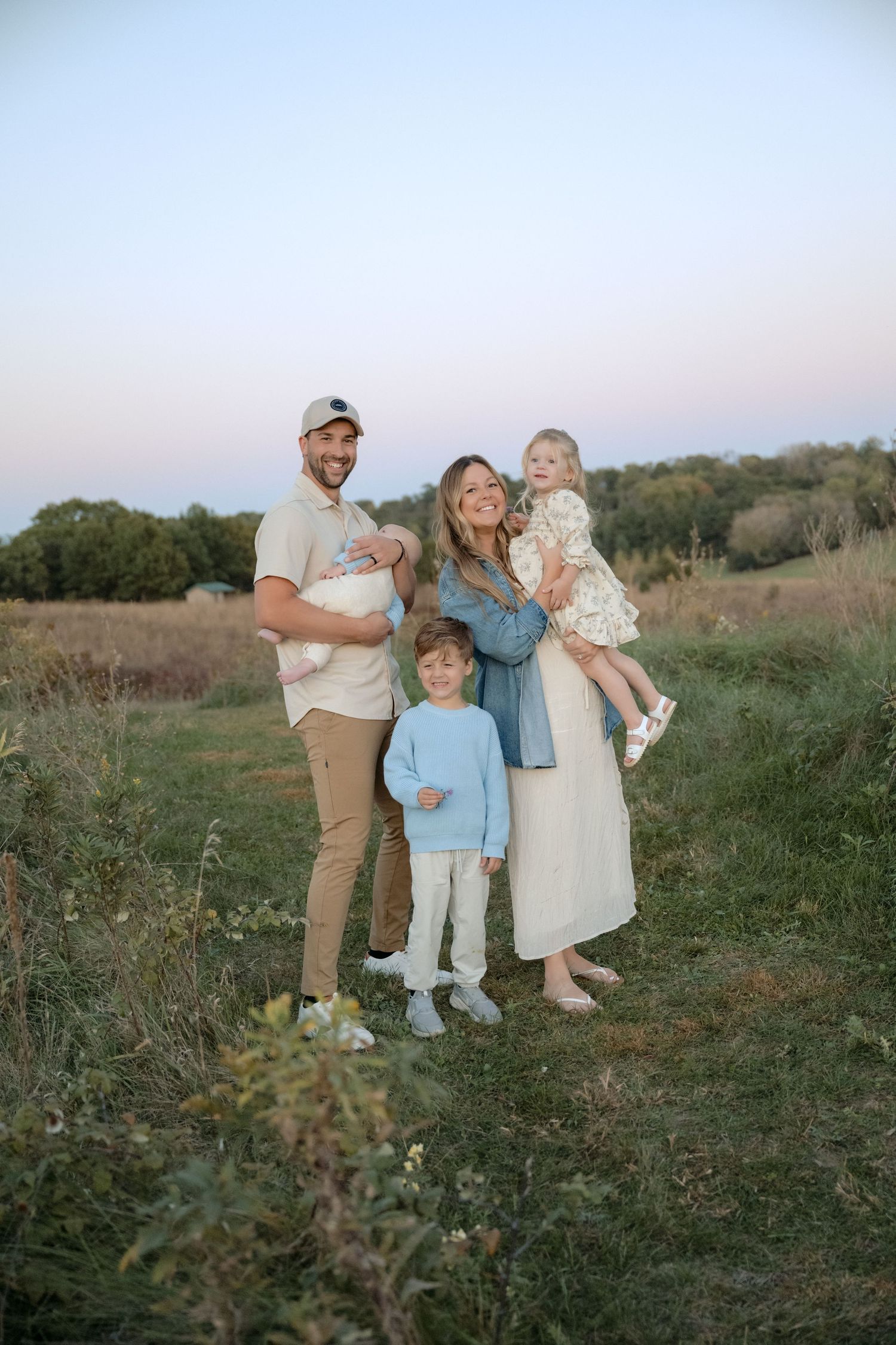 full family portrait during sunset to wrap up a fall mini session in hudson wisconsin taken by jagger rose photography