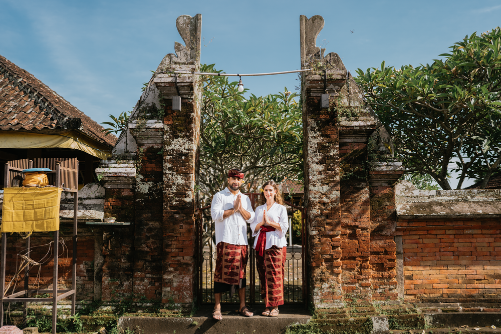 Couple wearing traditional Balinese attire during a photoshoot at The Wakanda Ubud.