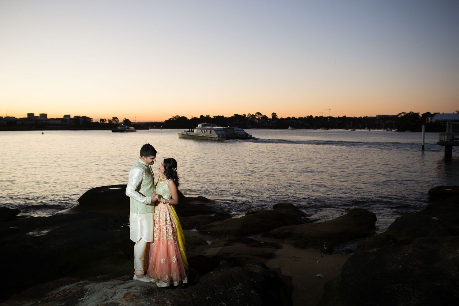 Indian bride and groom at sunset by the water, captured by Ipswich and Felixstowe wedding photographer.