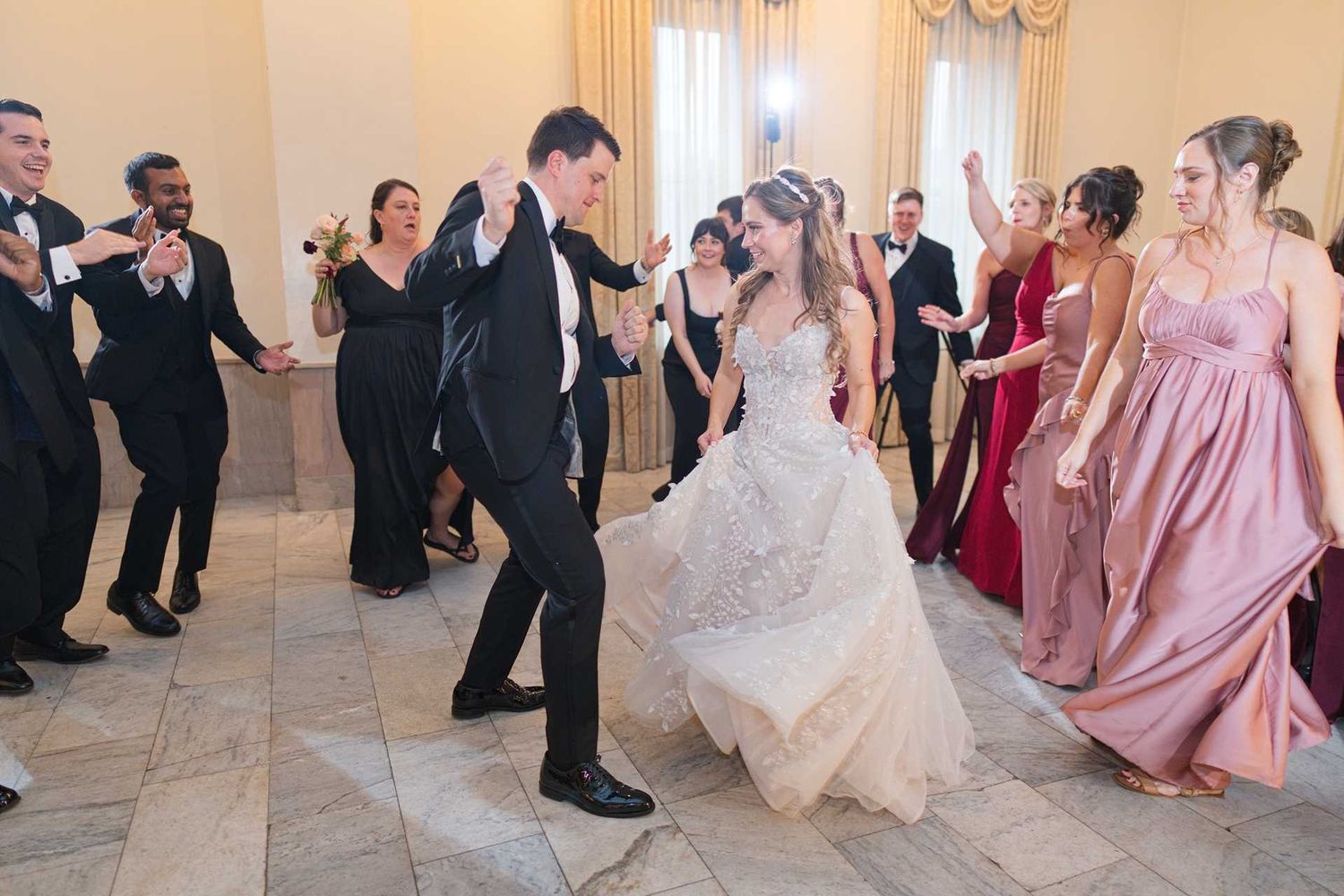 Bride and groom dancing joyfully at wedding reception of The Westin Great Southern Columbus Wedding Venue