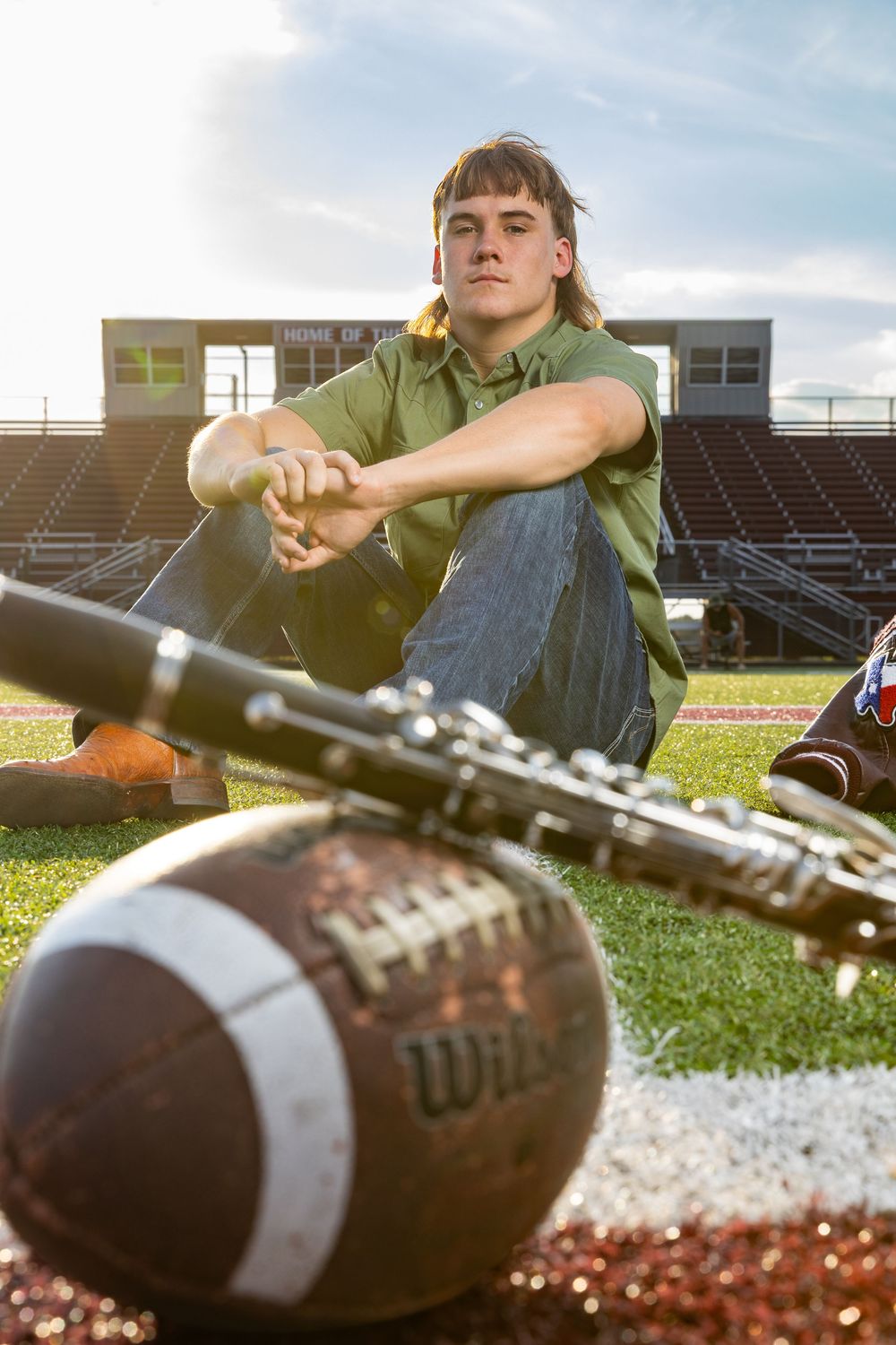 high school senior boy photos with football and clarinet