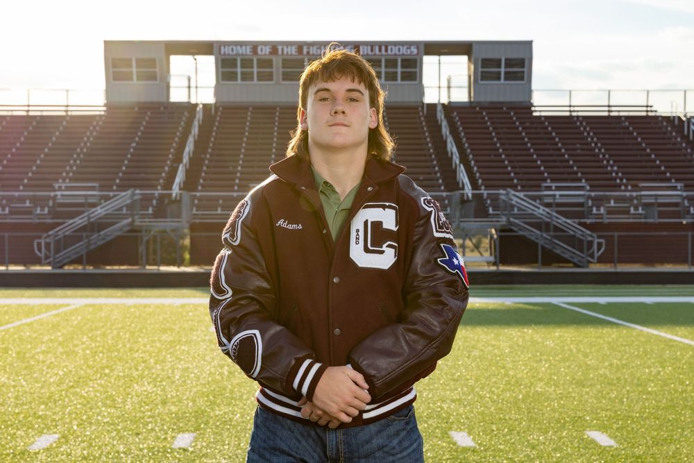football player on field for high school senior pictures