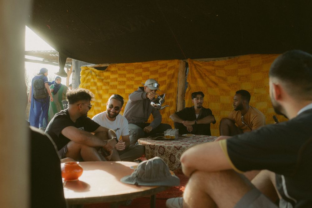 Candid photo of groomsmen Day out go karting in morocco for international wedding.