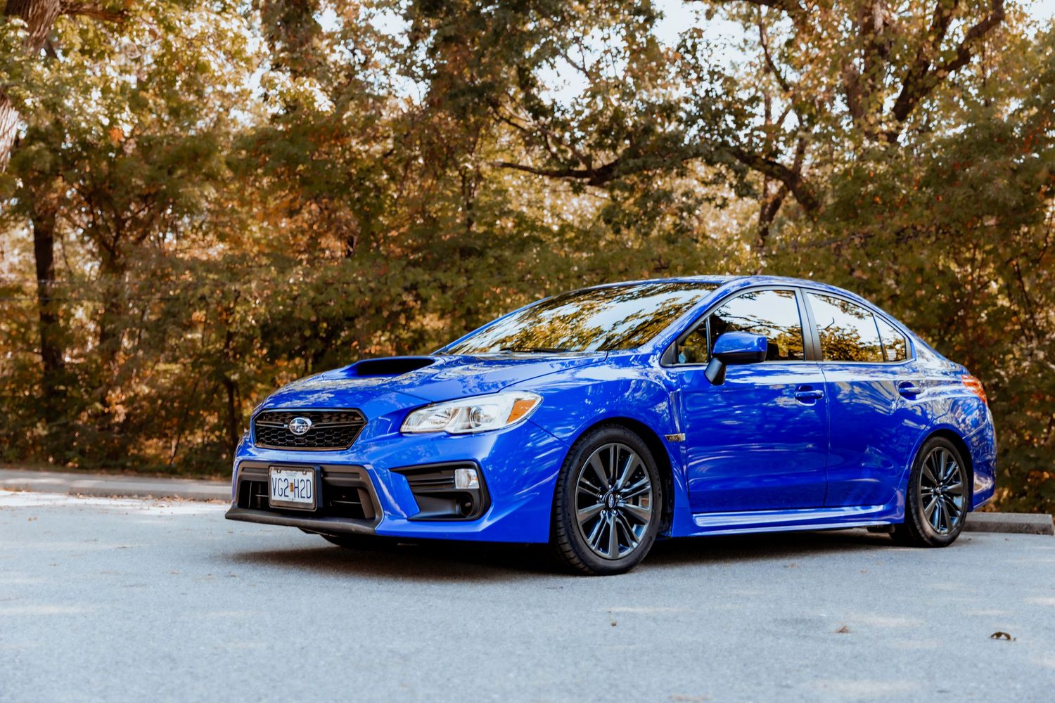 Vehicle detail/environmental shot — natural Ozarks backdrop — Laura Simpson