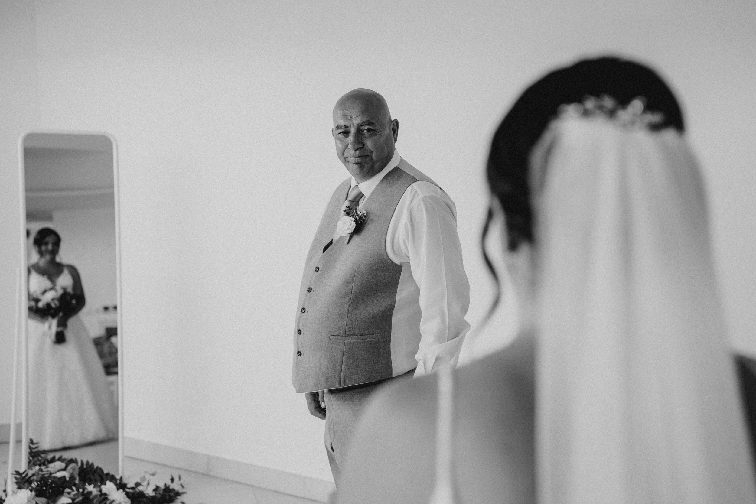 Black and white wedding preparation photos showing details of getting ready with formal attire and candid moments.