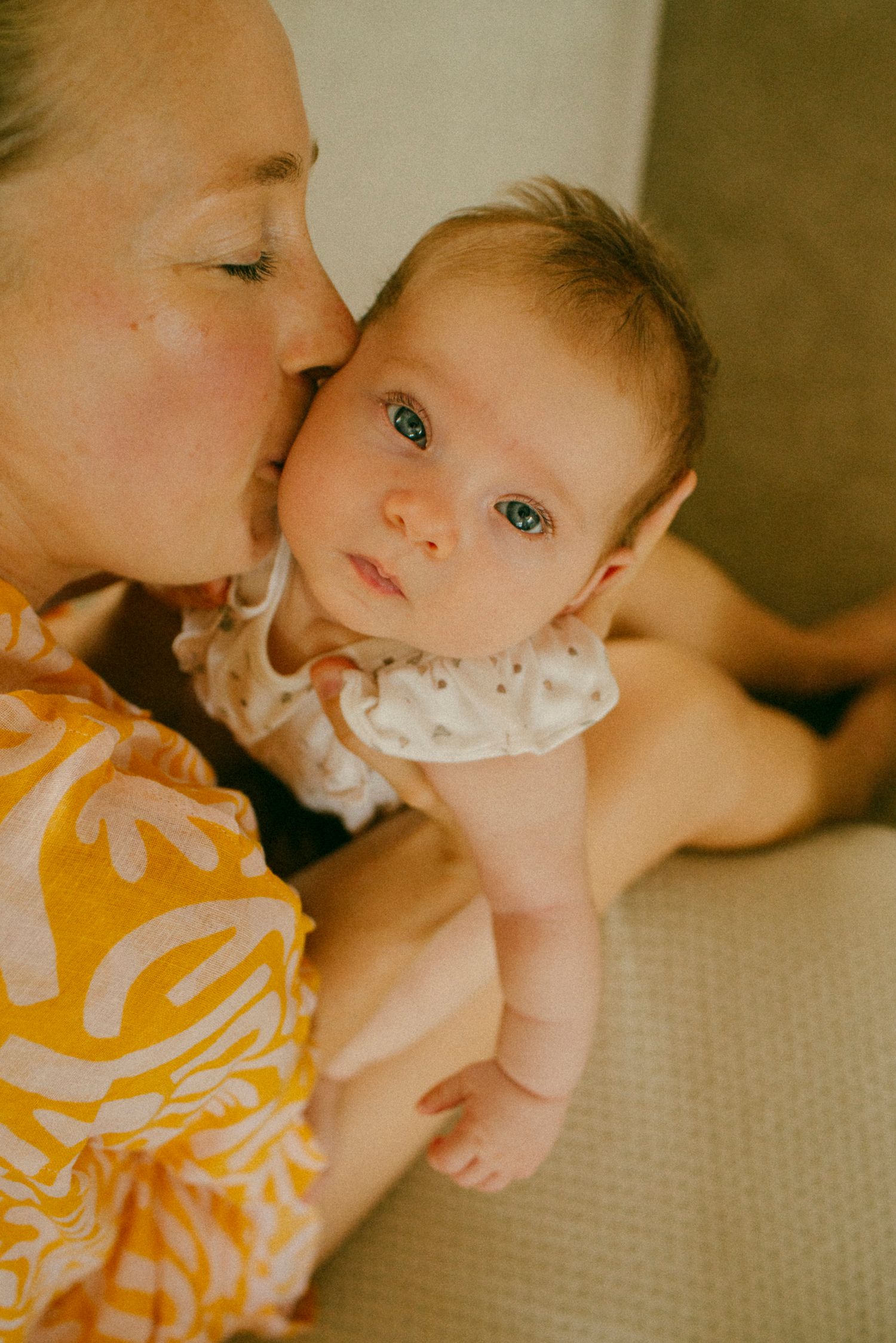 Few-month-old baby enjoying a lifestyle newborn session at home in Sydney & Northern Beaches, capturing genuine, playful, and tender family