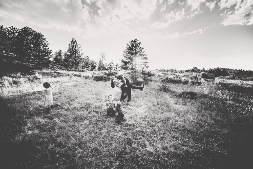 Family plays with eachother in black and white in Dickson, TN