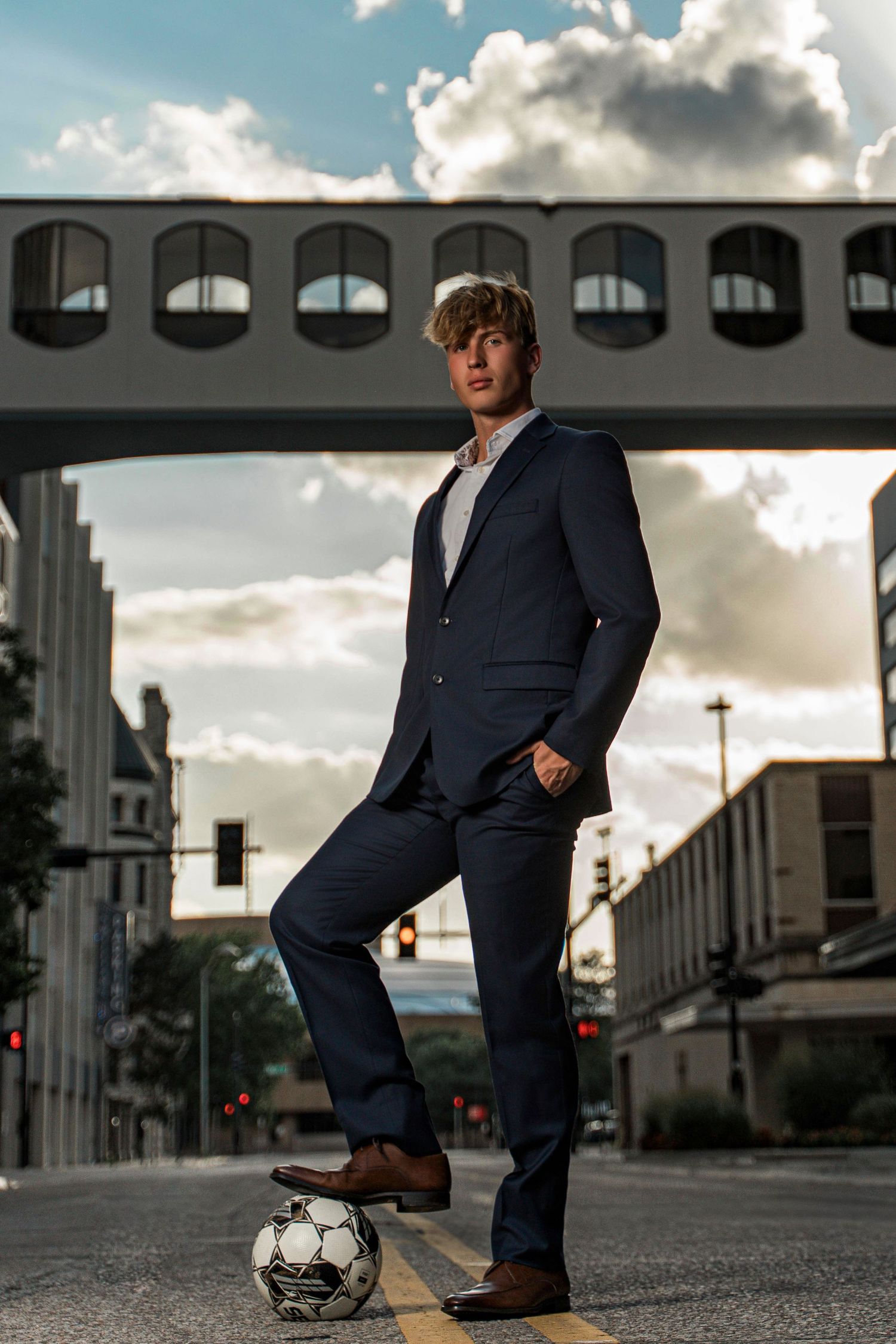 Professional business portrait session on a city street at sunset.