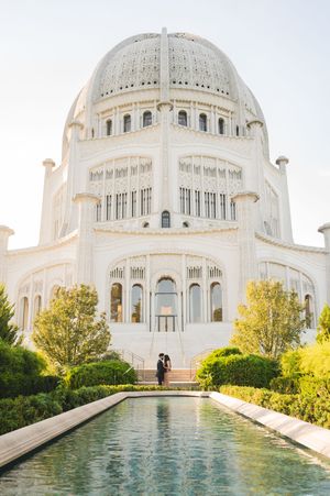 Panoramic view of the majestic Bahai Temple with its ornate domes and reflecting pools in Chicago, Illinois.