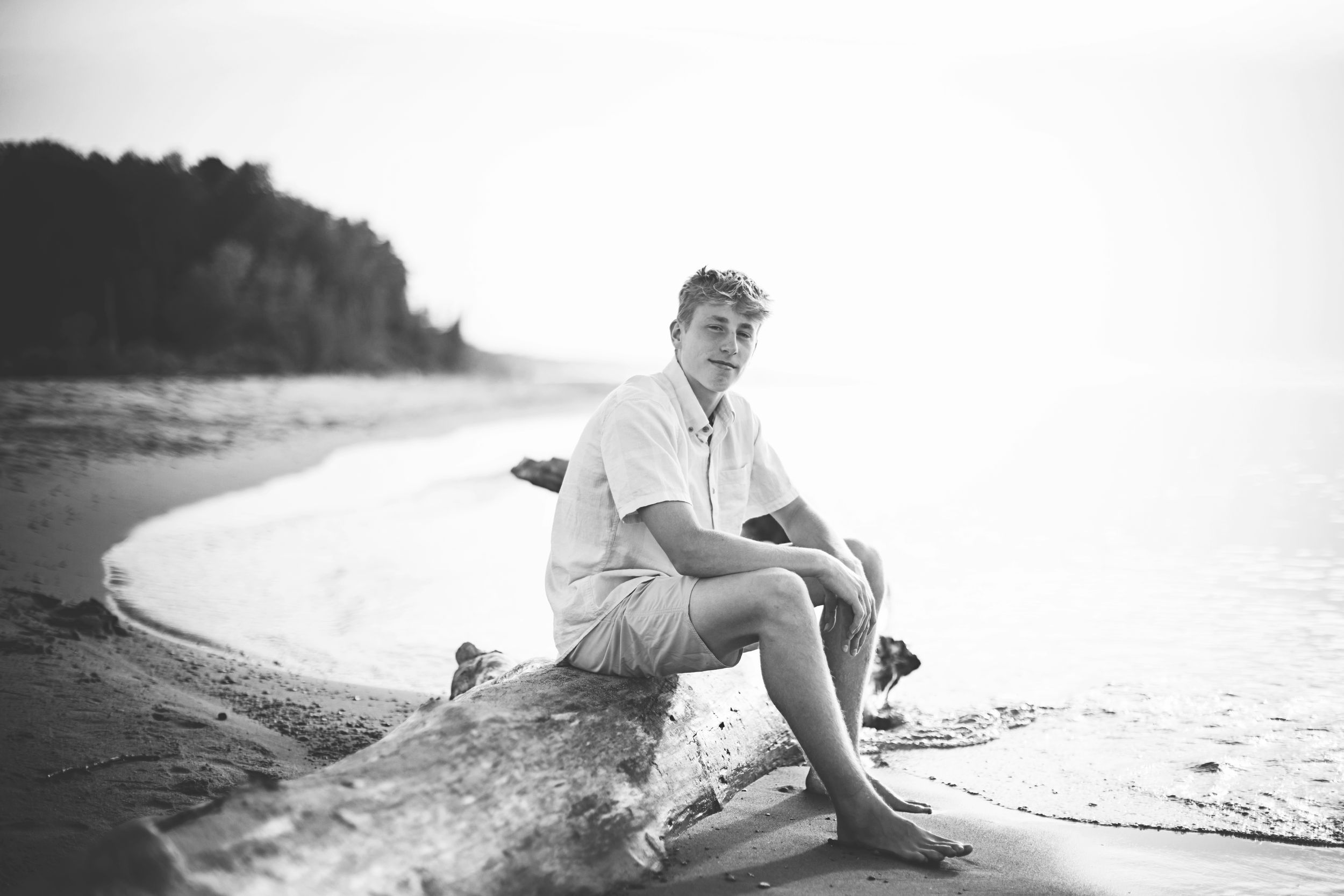 A black and white series of photos showing a person relaxing on a beach in vintage style clothing.