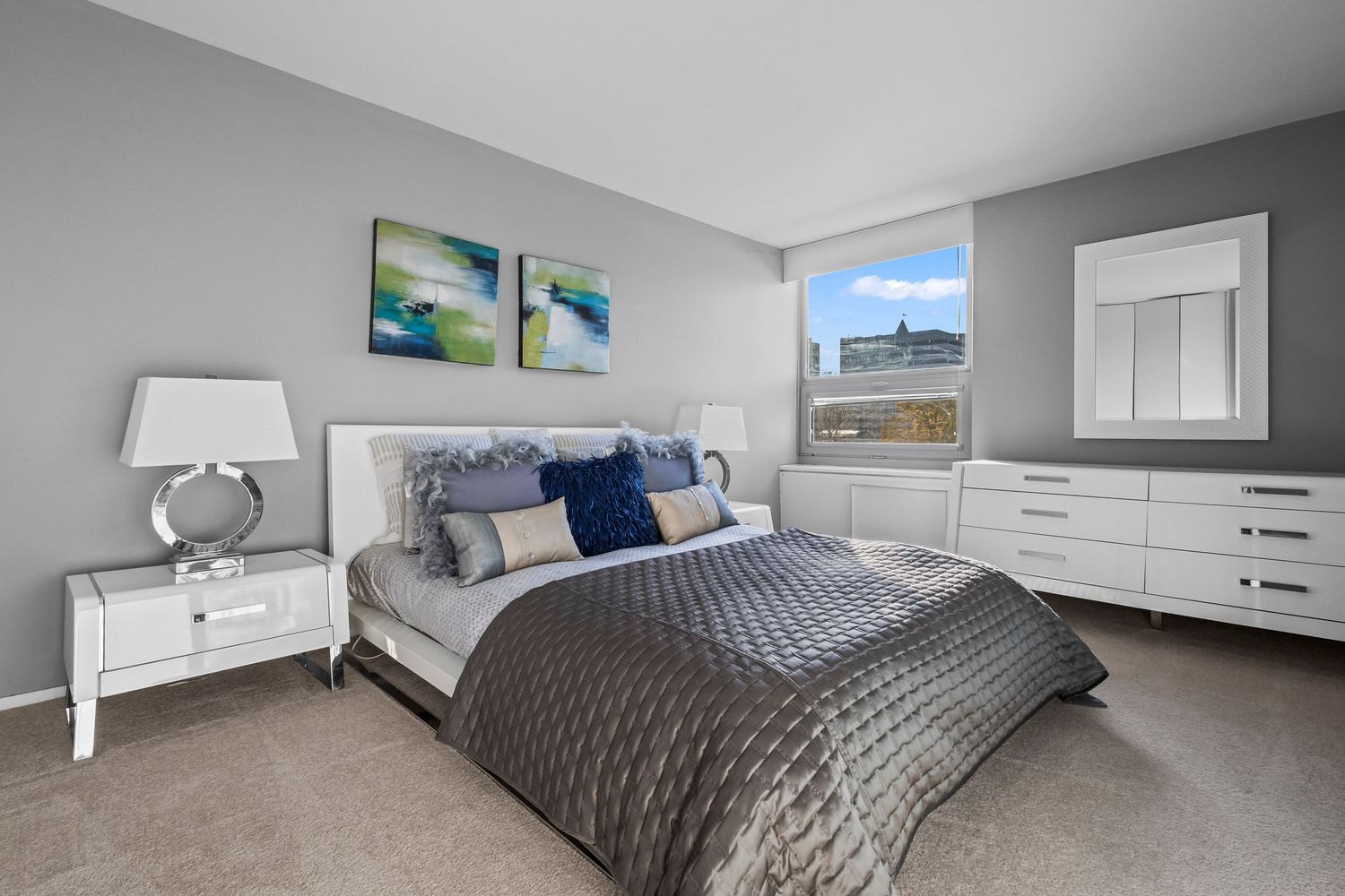 One-bedroom apartment interior with white furniture and coastal decor, Wisconsin real estate photography