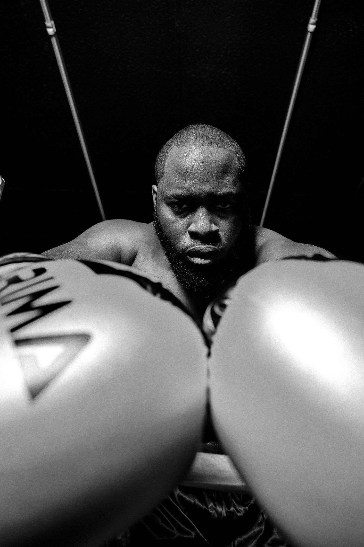 A black and white photo sequence shows a person's face gradually appearing behind white balloons.