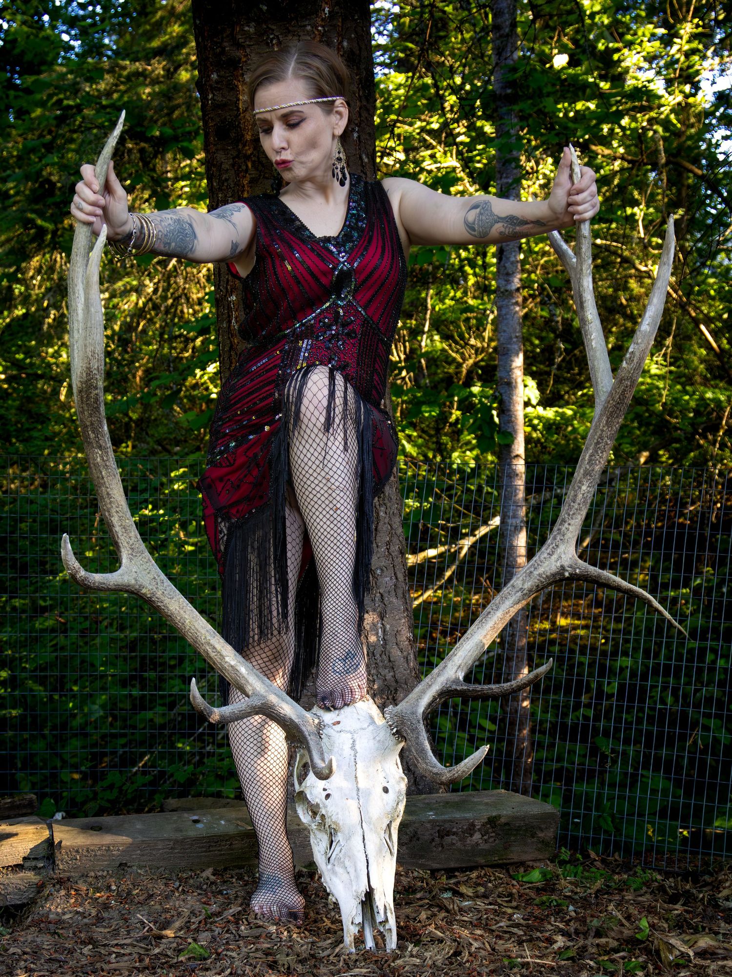 Bree Posing with a 1920s flapper dress with a El skull and horns
