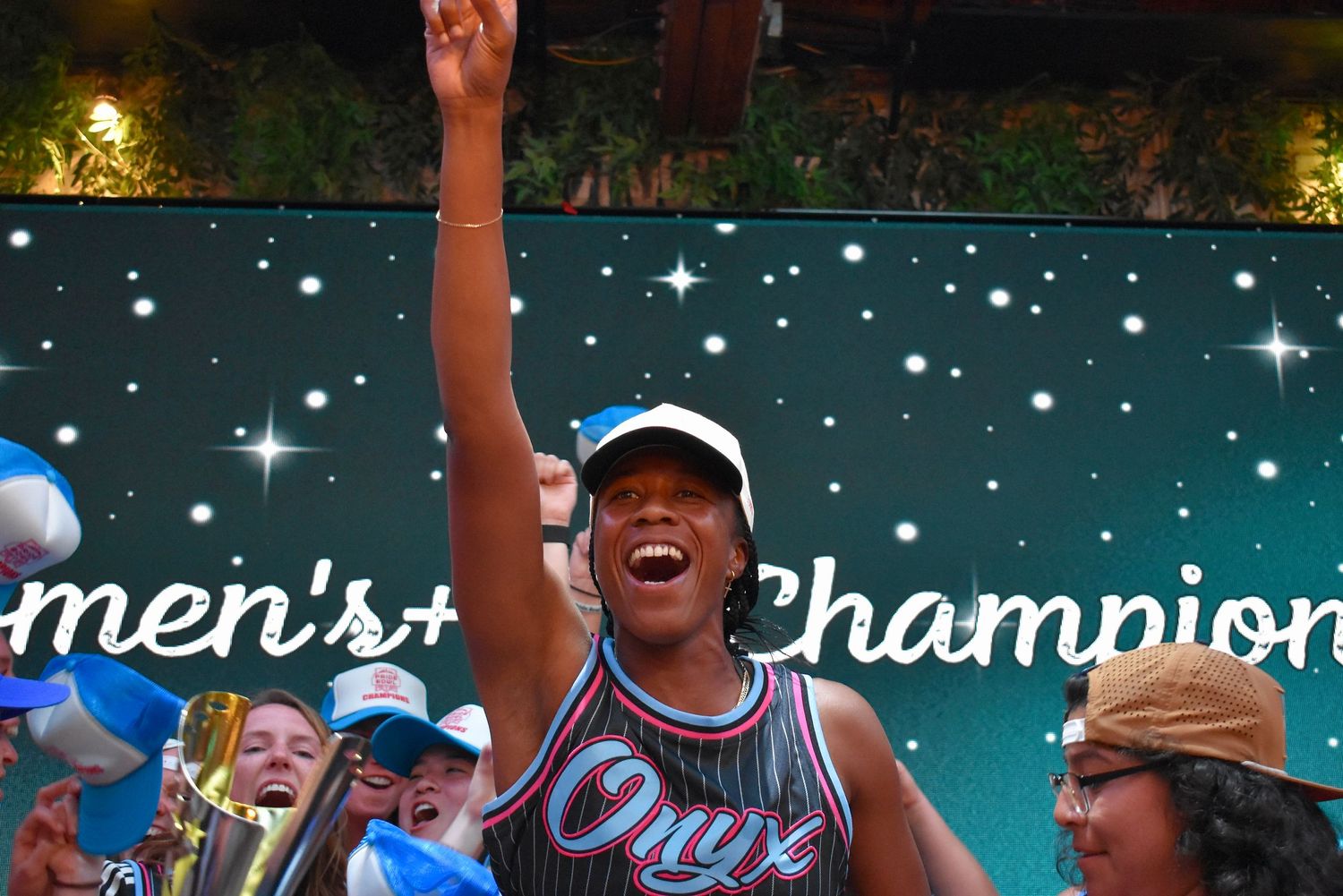 A player celebrates a championship at a closing party event for Pride Bowl in Chicago hosted by CMSA