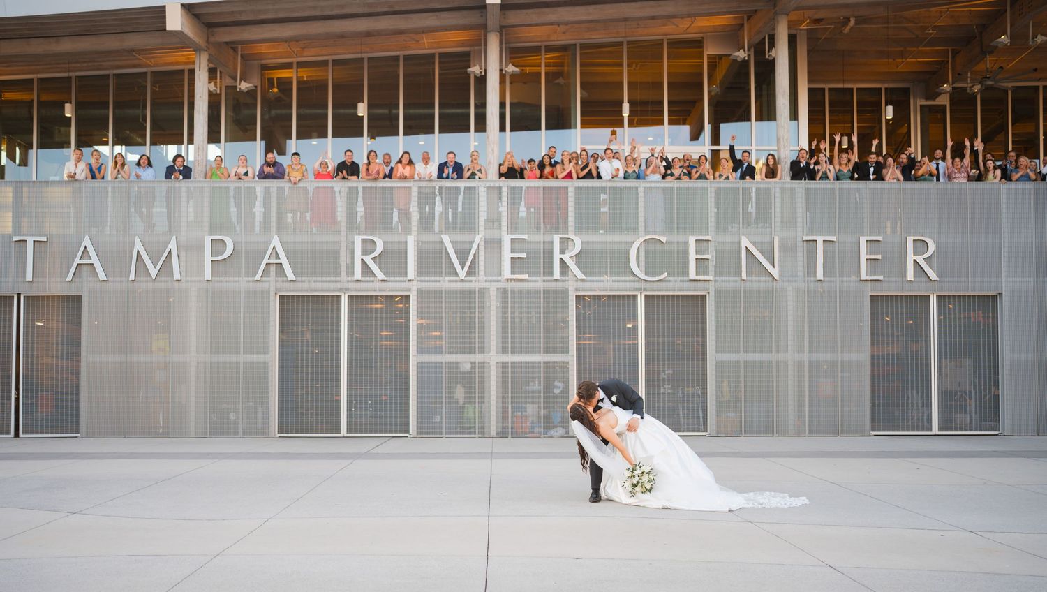 A traditional church wedding ceremony with a long veil trailing down the aisle.