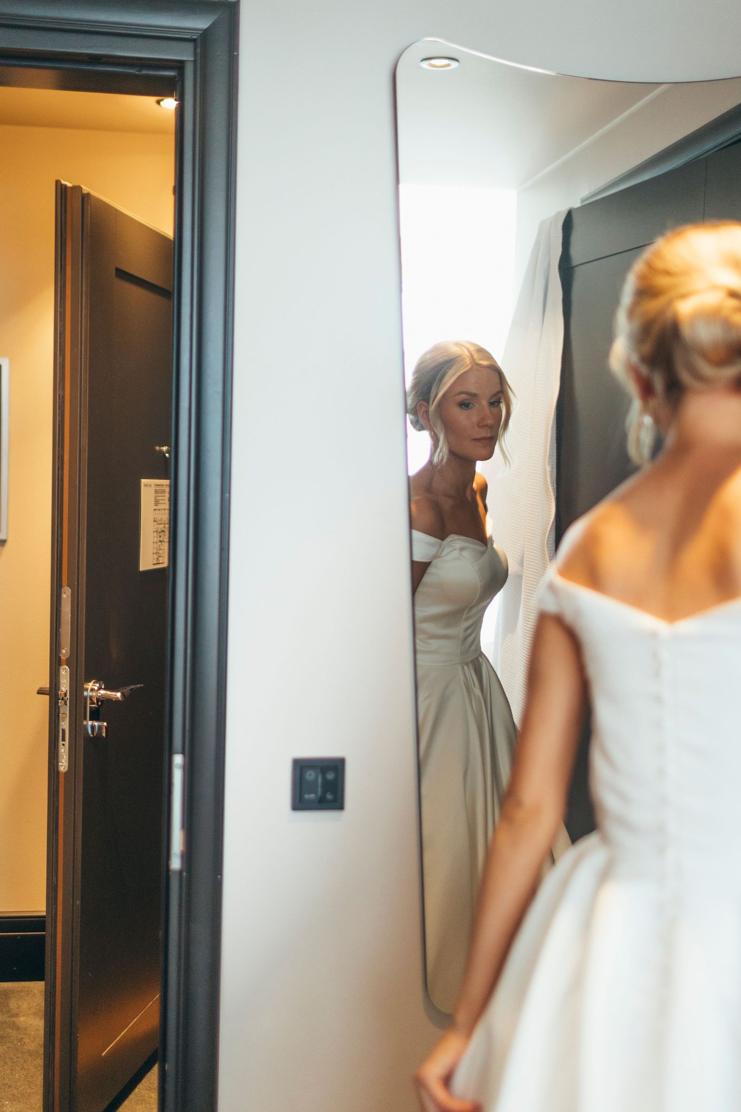 Elegant bridal preparations captured in mirror reflections.