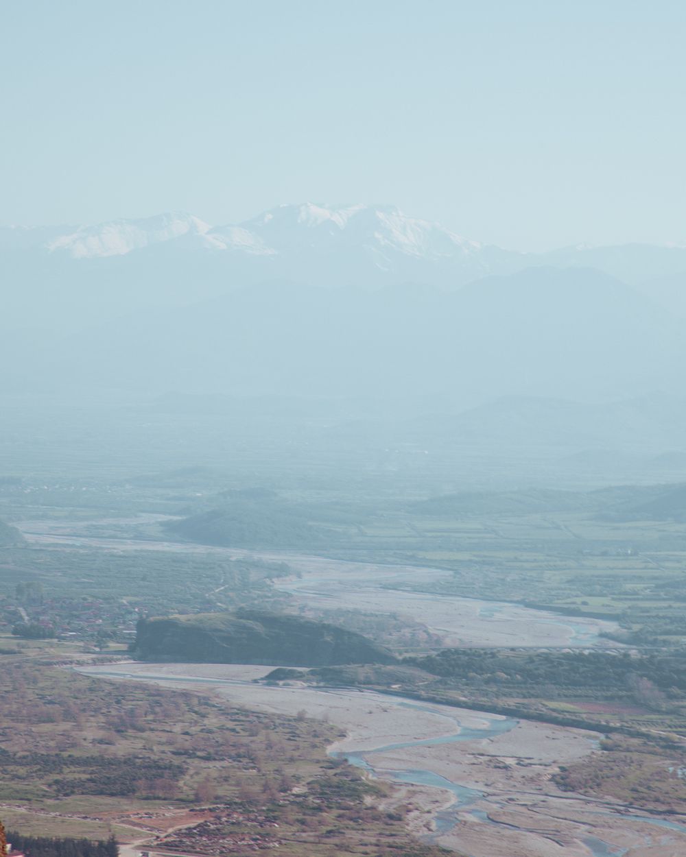 Aerial view of winding river through a vast rural valley