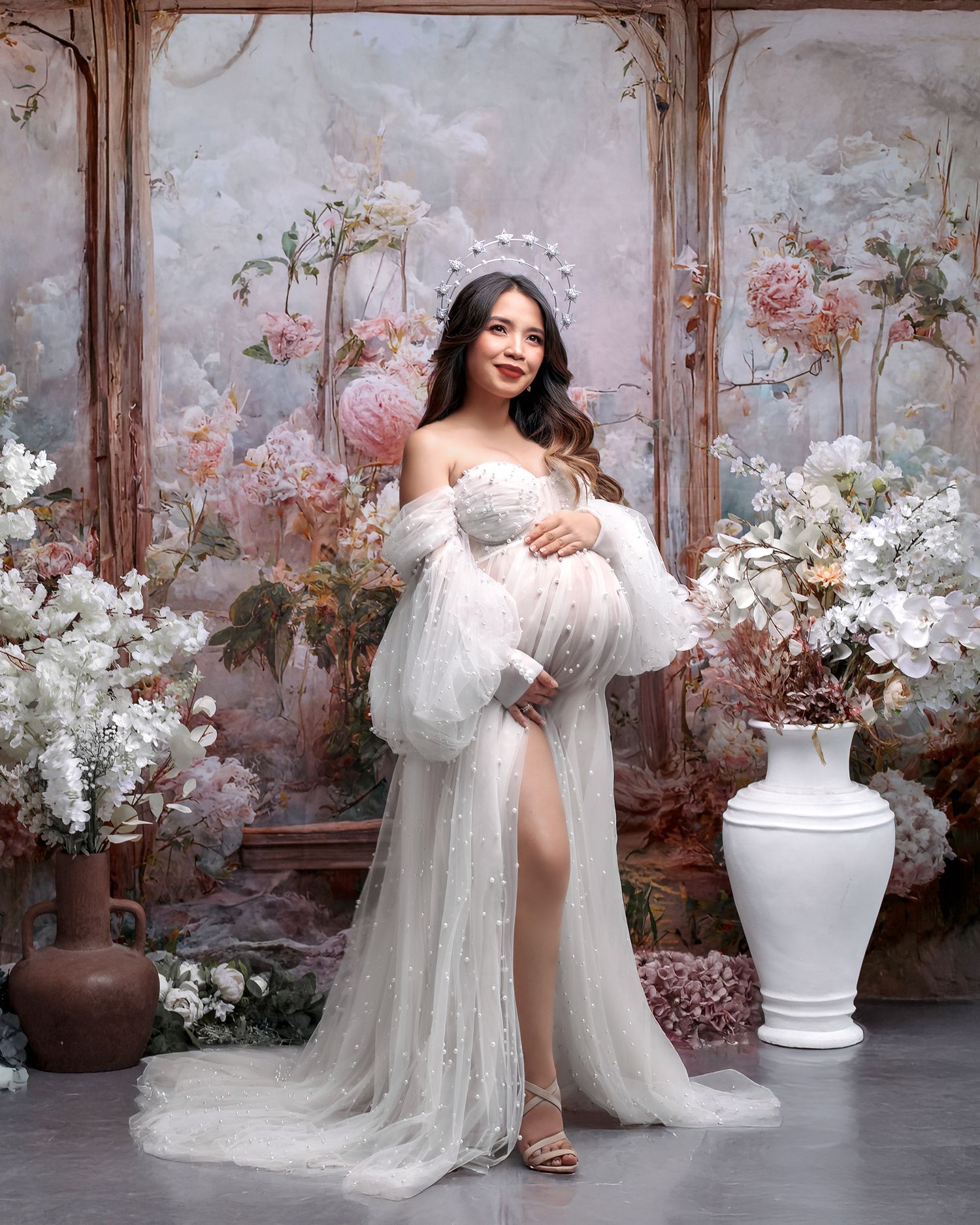 Fine art white pearl gown against flower filled backdrop portrait, celebrating the journey to motherhood with Caz Captures
