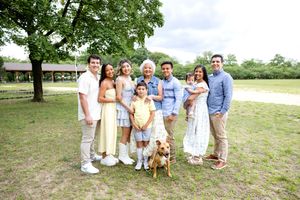 Family Extended Photo Session in light summer clothing outdoors on a grassy area under a tree. Family NJ photographer