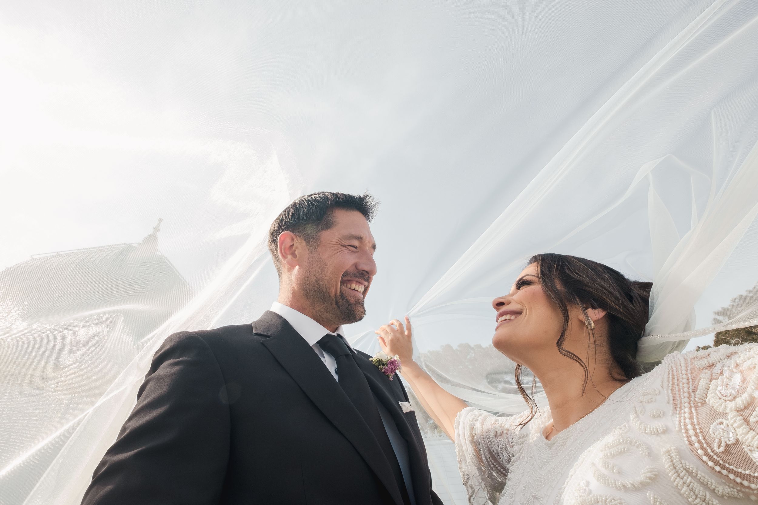 Couple during a post wedding photo shoot at the conservatory of flowers.