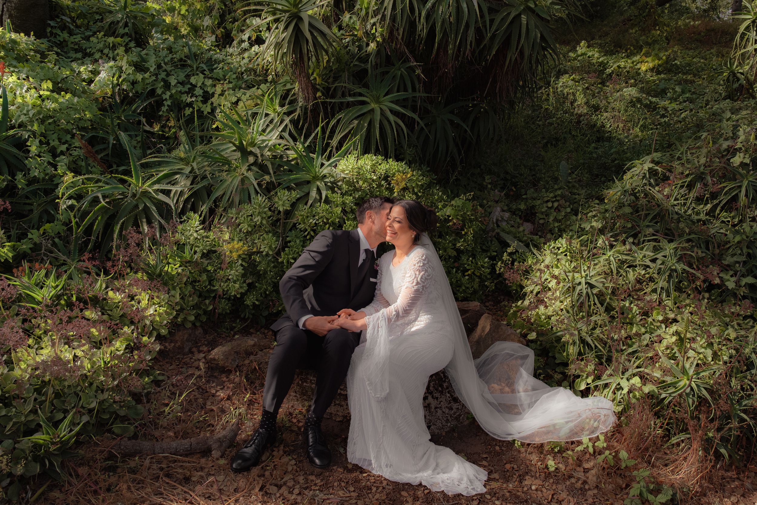 Couple during a post wedding photo shoot at the conservatory of flowers.