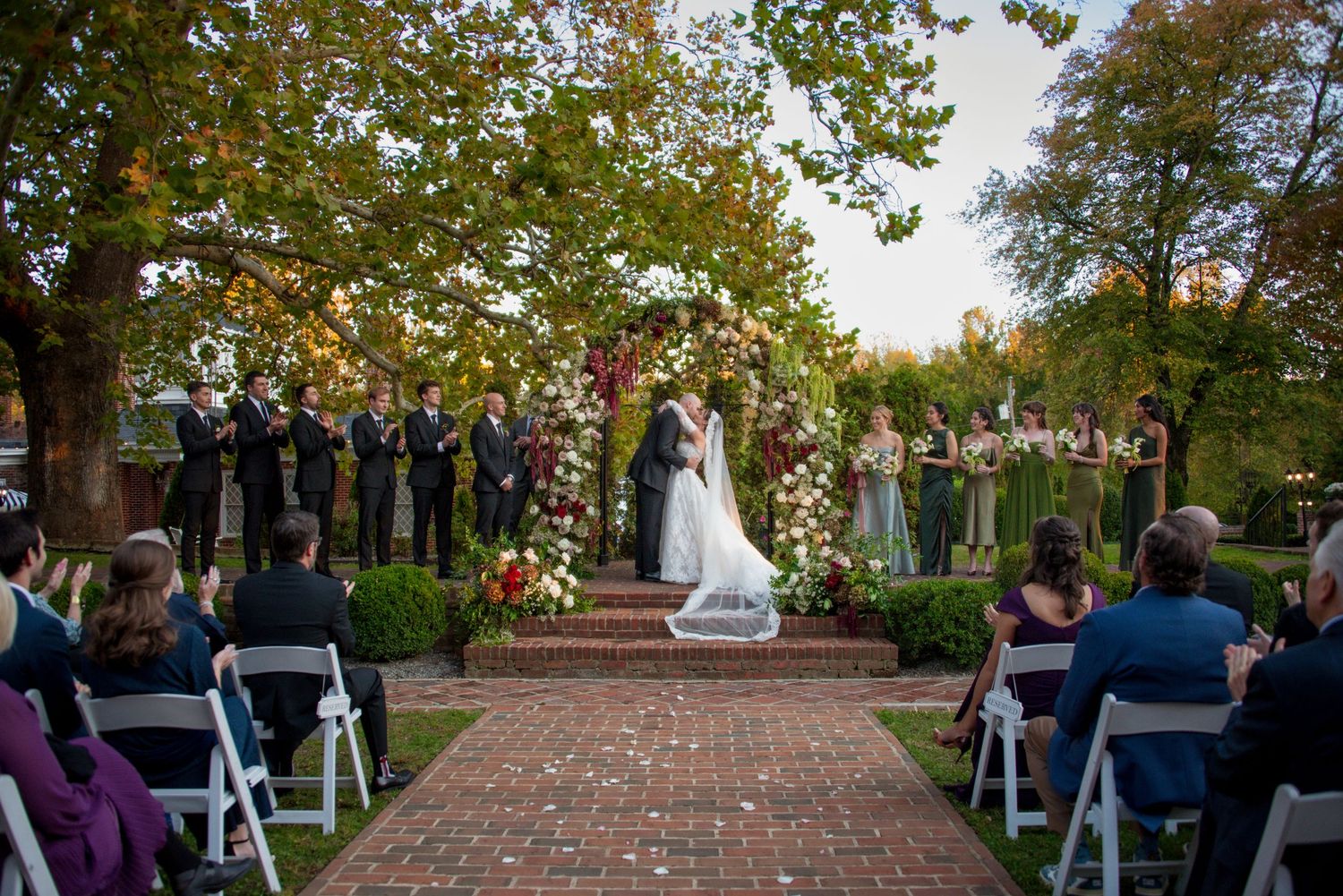 Bride and groom kiss at the altar