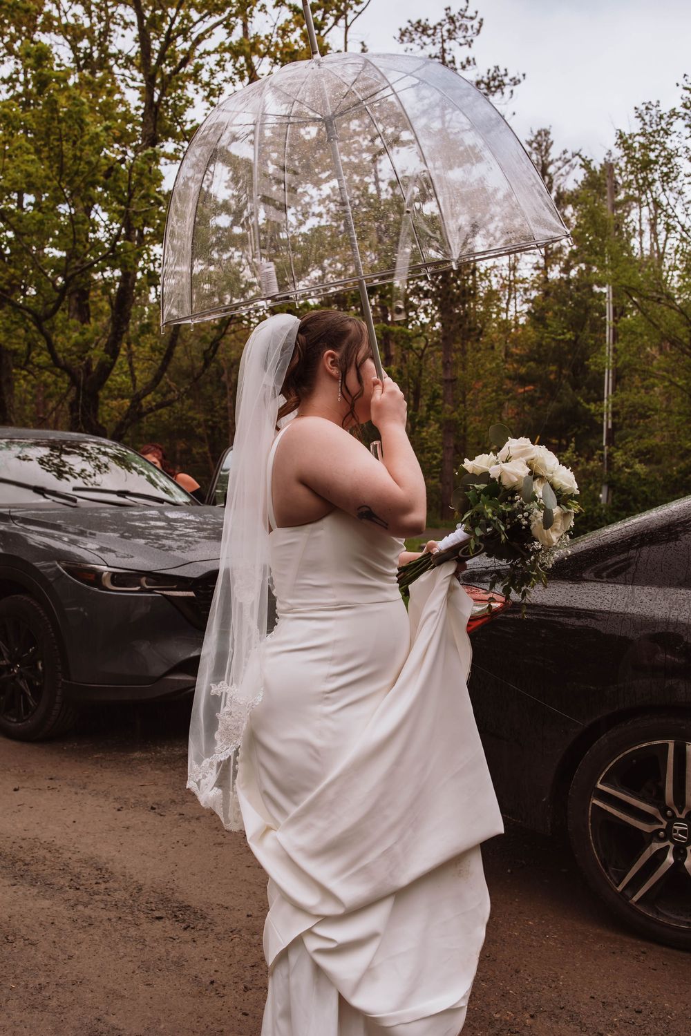 rain falling softly after portraits on wedding day