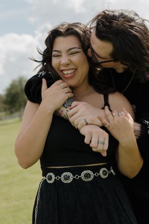 Series of candid black and white photos showing playful interaction between a couple.