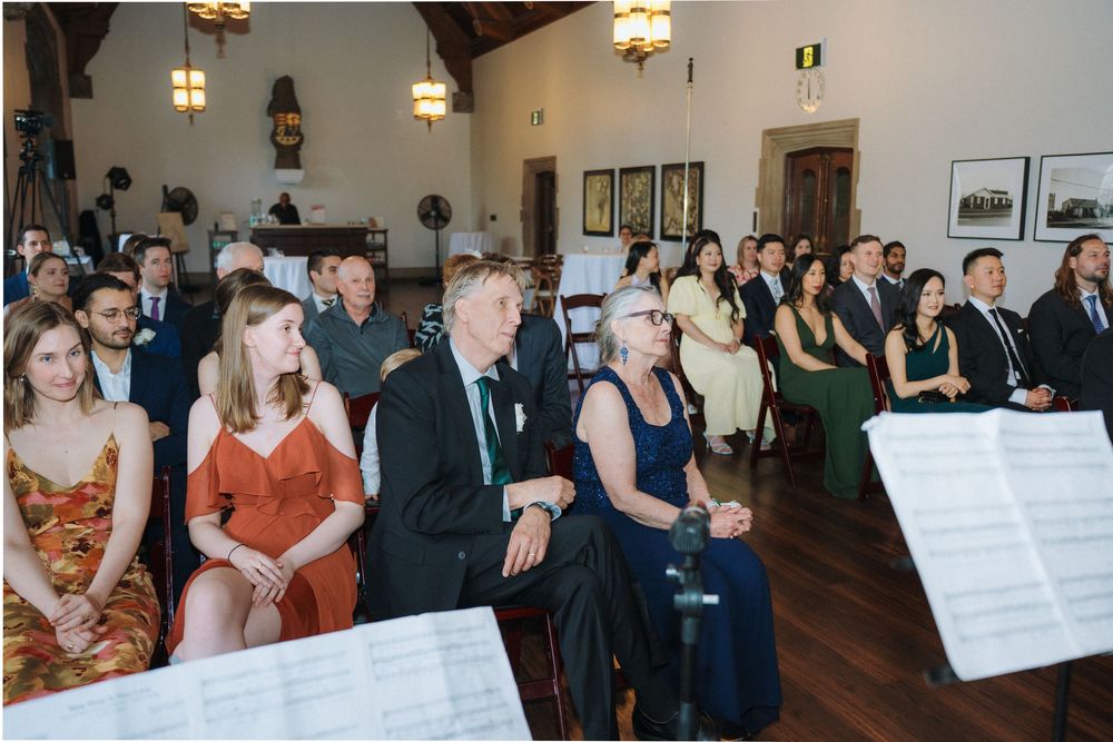 Elegant indoor wedding photography at Hart House in Toronto, capturing romantic moments.