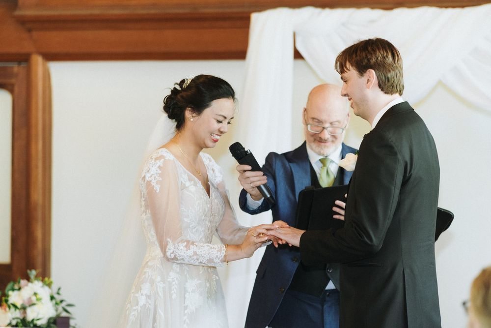 Elegant indoor wedding photography at Hart House in Toronto, capturing romantic moments.
