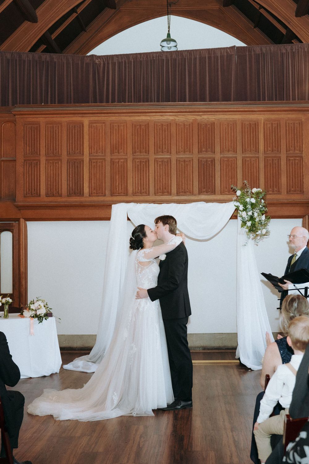 Elegant indoor wedding photography at Hart House in Toronto, capturing romantic moments.