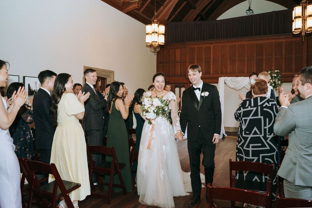 Elegant indoor wedding photography at Hart House in Toronto, capturing romantic moments.