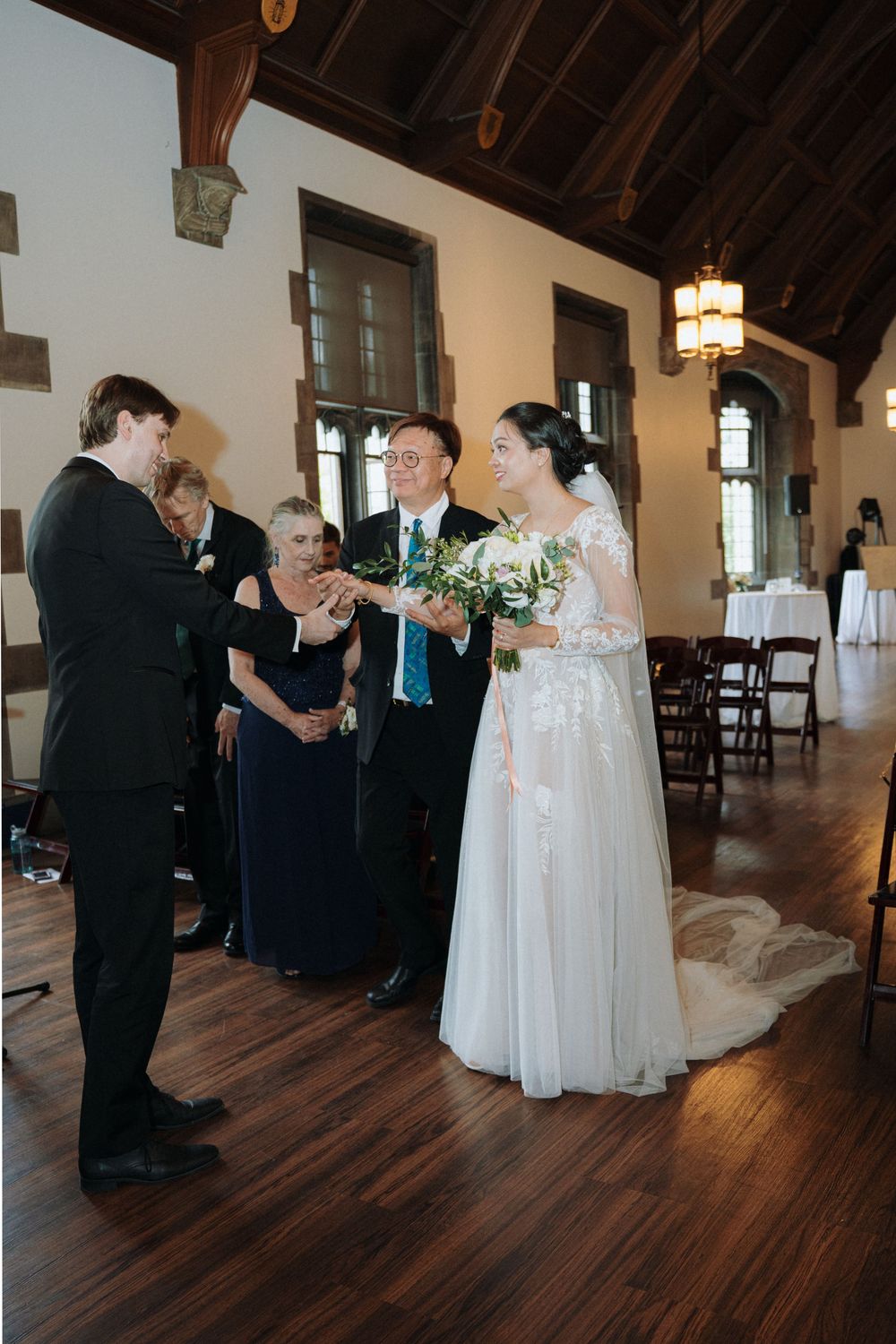 Elegant indoor wedding photography at Hart House in Toronto, capturing romantic moments.