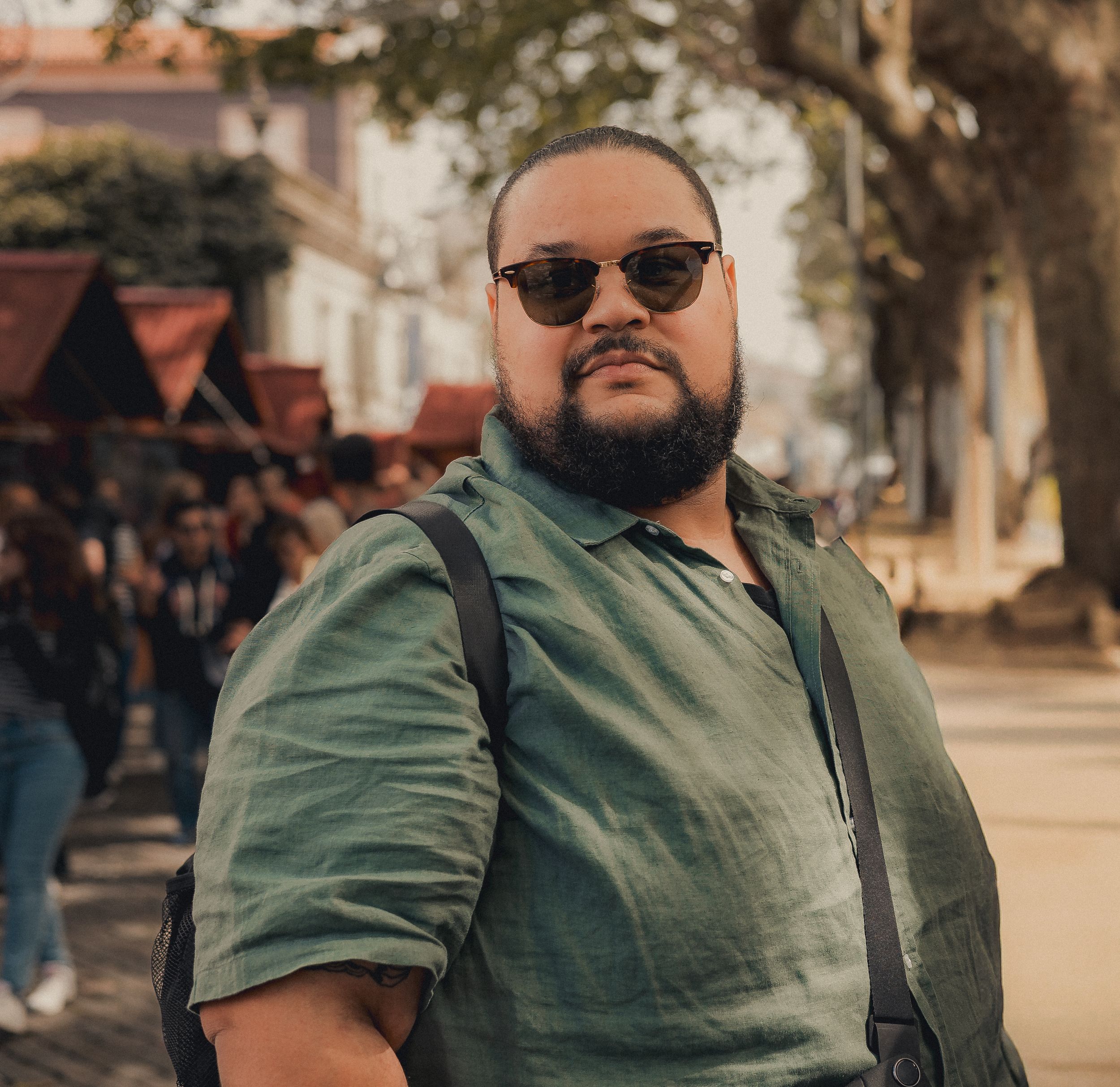 Casual outdoor portrait series in warm tones with urban setting.