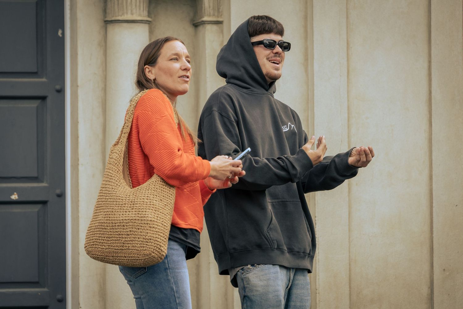Behind the scenes - a man and his step mother watch on during a photo shoot.