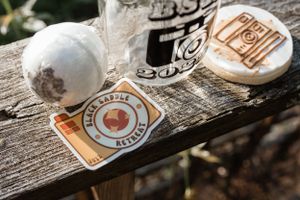 Wedding-themed stickers and decorative items arranged on rustic wooden surface.