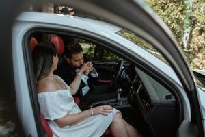 Interior car shot of couple having intimate conversation.