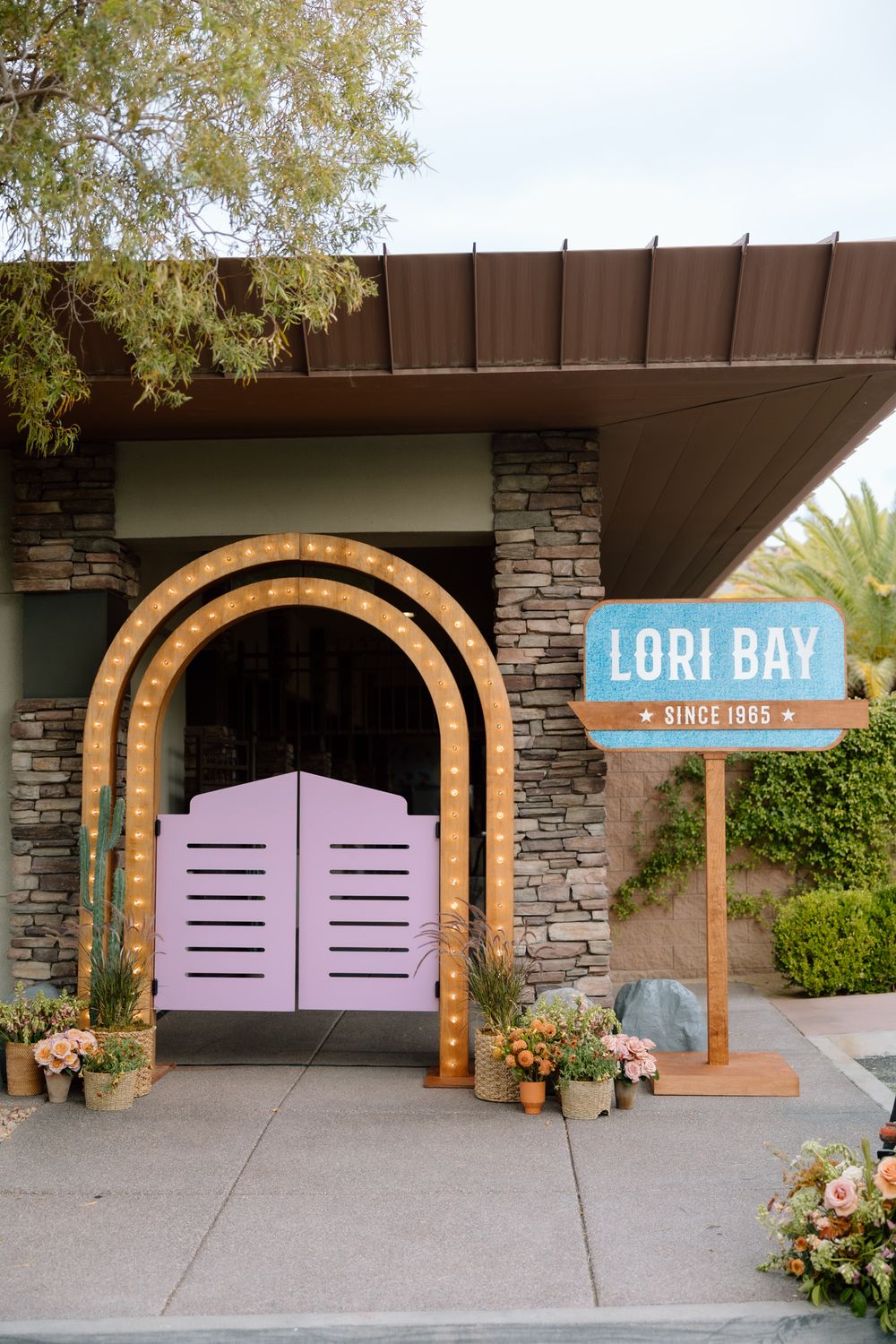 barn door pink party western details with floral and Western-inspired decor las vegas party event photographer julia stockton
