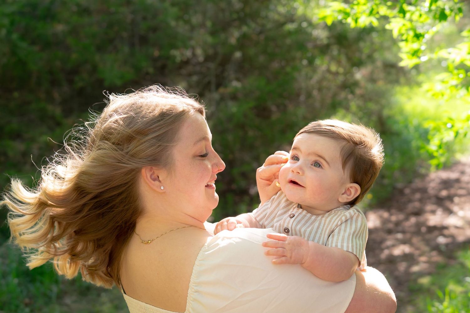 Sunlit outdoor scene with natural greenery and soft lighting effects.