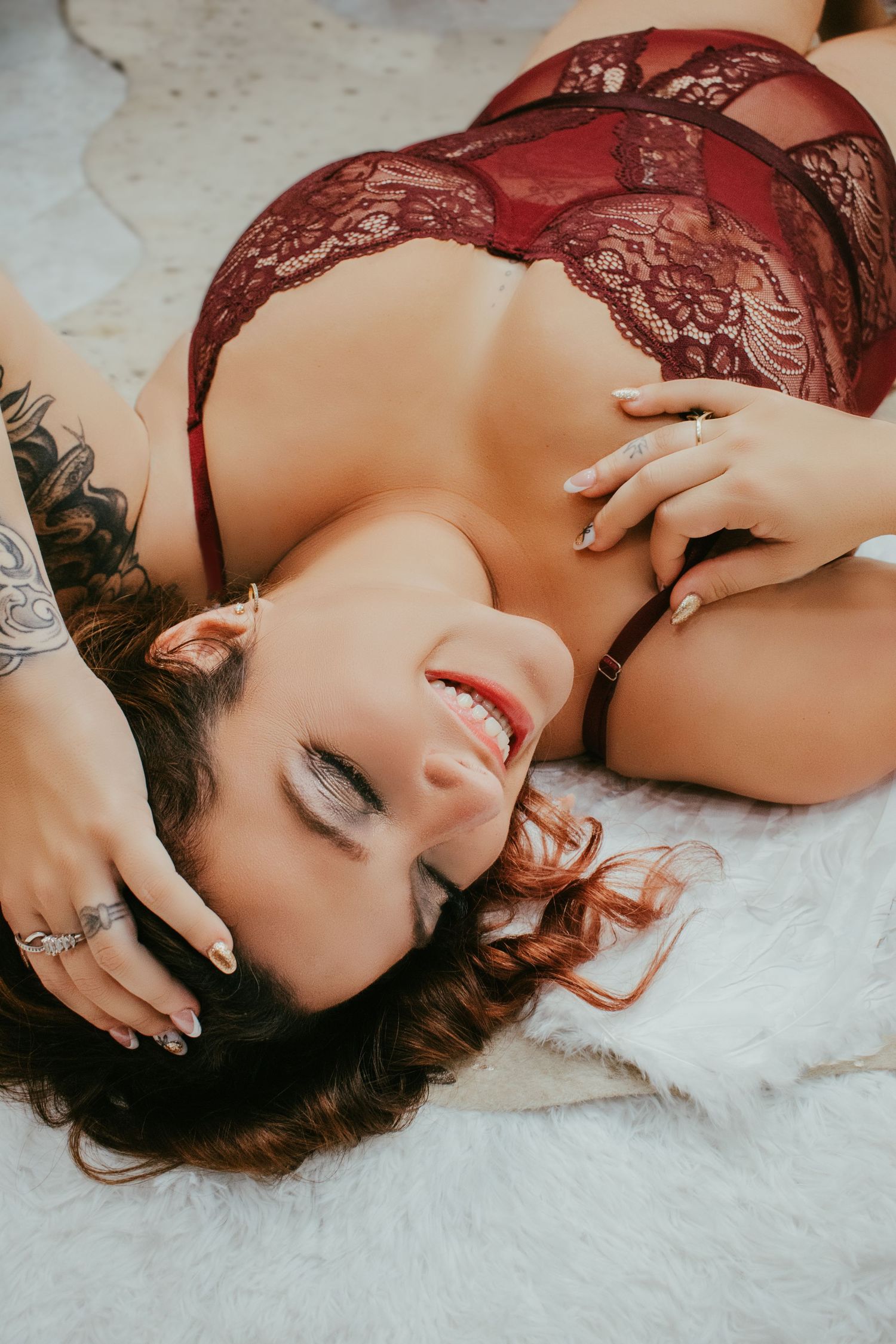 Plus size boudoir photo of woman lying on gold flecked animal print rug | Body positive boudoir in Venice, FL