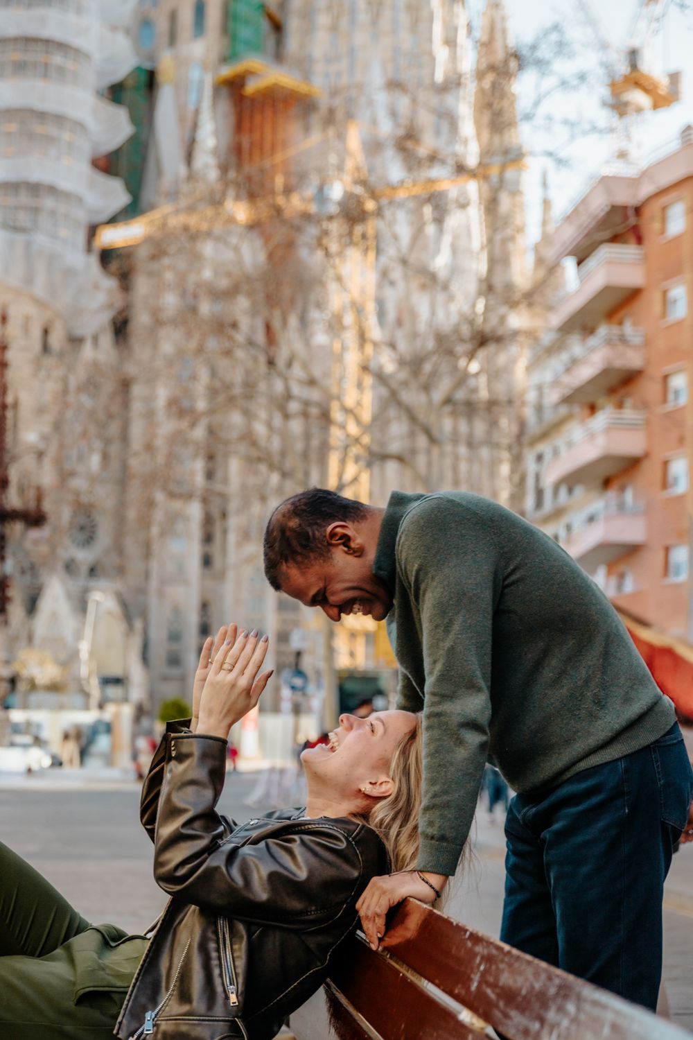 Romantic silhouette of the couple against the intricate church façade