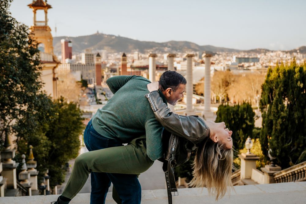 Backview of them walking toward the Montjuïc gardens during sunset.