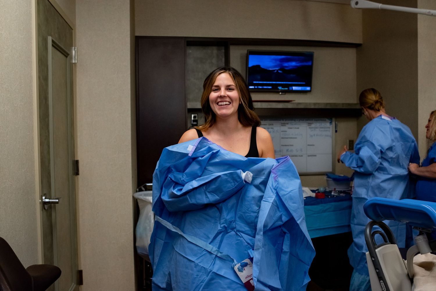 Bio-mom gets ready to assist in the delivery of her surrogate baby.